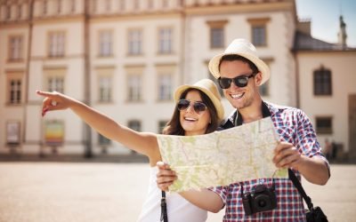 Happy tourist sightseeing city with map